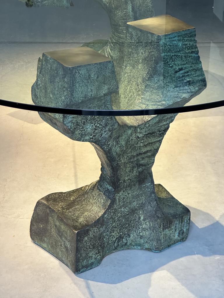 A Sculptural Bronze and Glass Dining Table