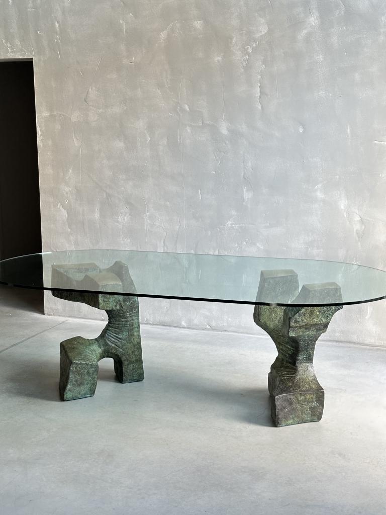 A Sculptural Bronze and Glass Dining Table