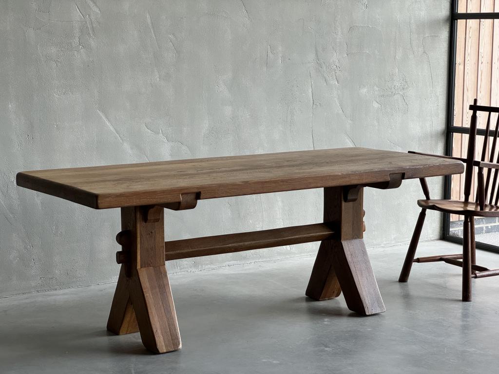 An Oak Dining Table by De Puydt