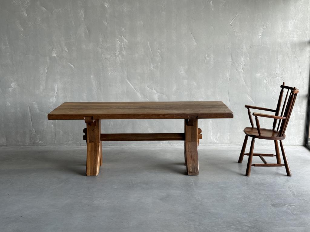 An Oak Dining Table by De Puydt
