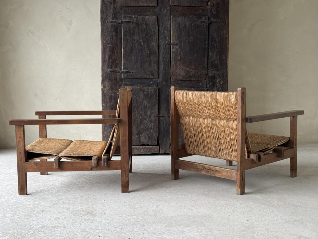 A pair of Spanish Rush seat Armchairs