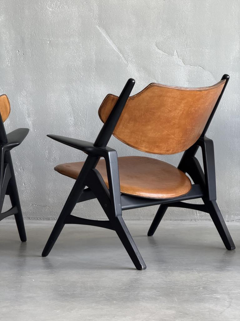 A Set of Hans Wegner style Leather Chairs