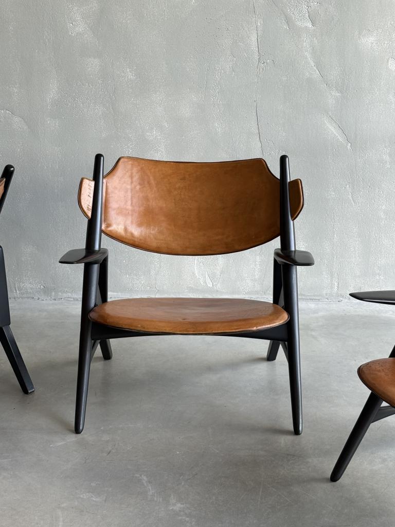 A Set of Hans Wegner style Leather Chairs