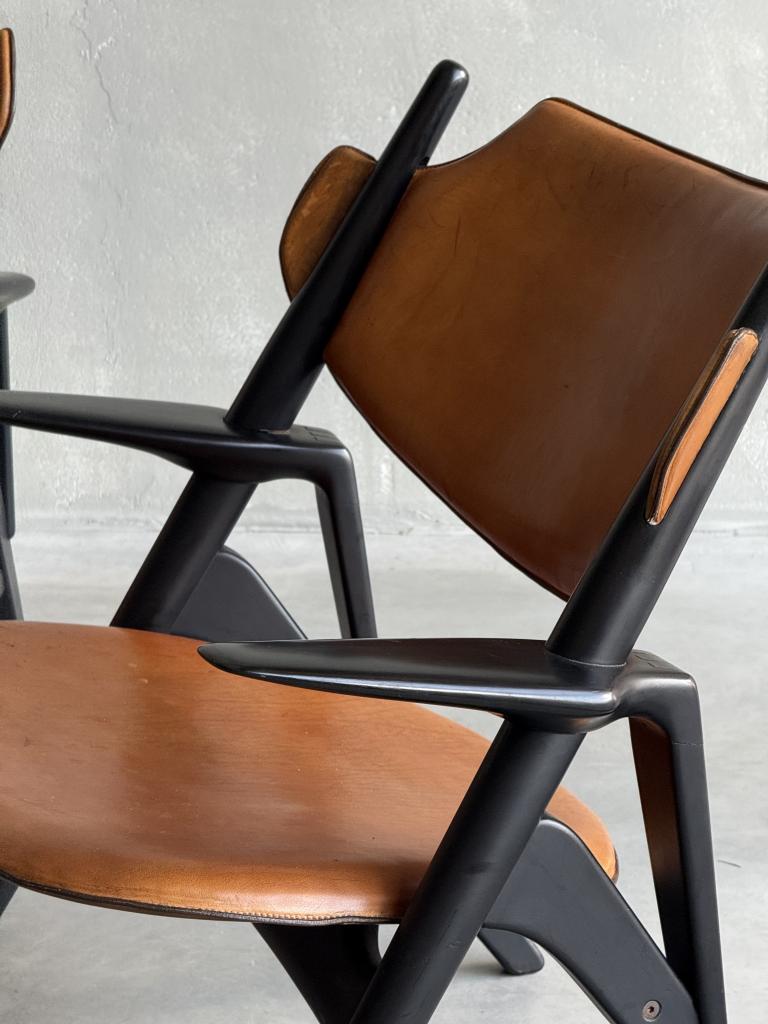 A Set of Hans Wegner style Leather Chairs