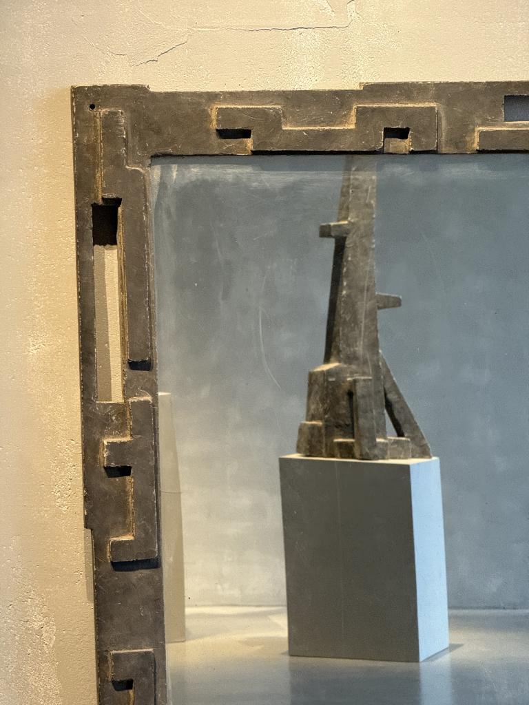 A Brutalist Concrete Mirror