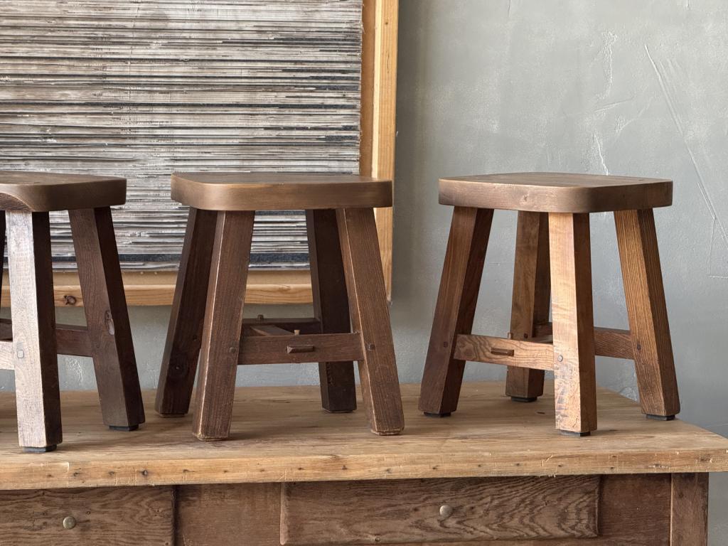 A set of 12 massive Elm Stools