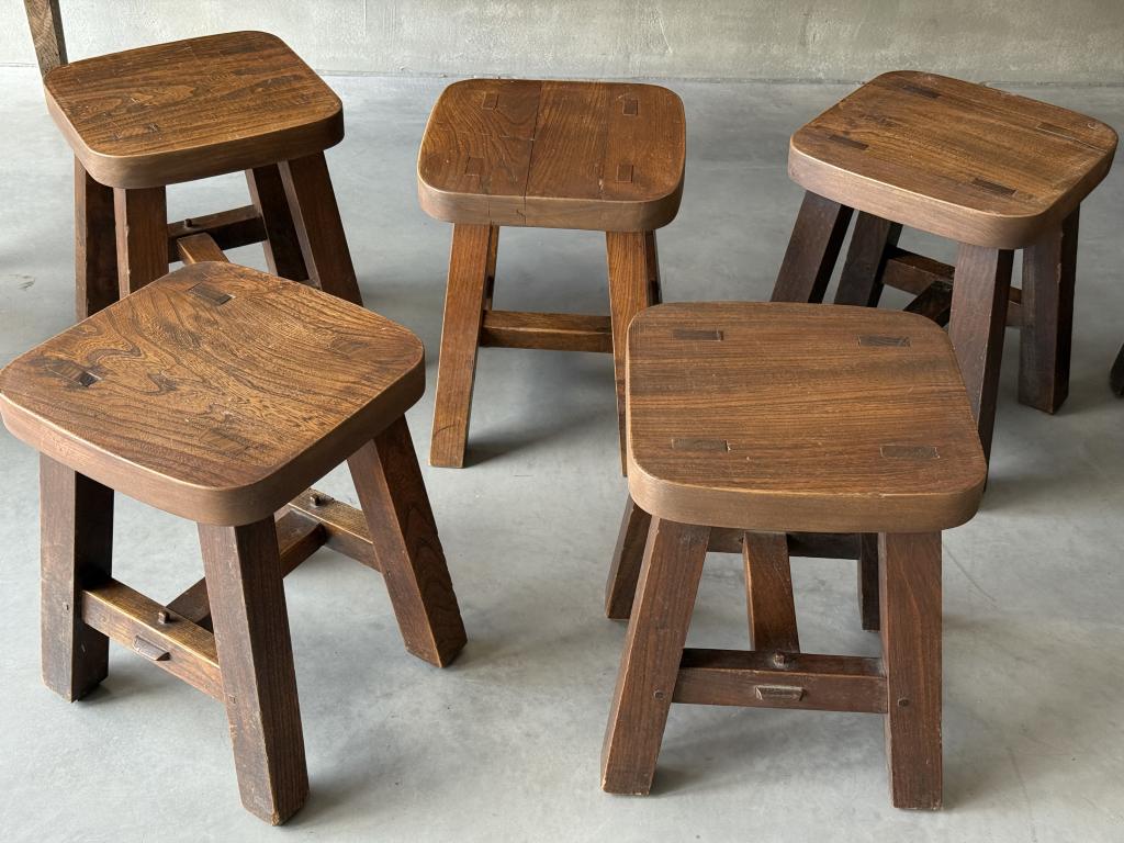 A set of 12 massive Elm Stools