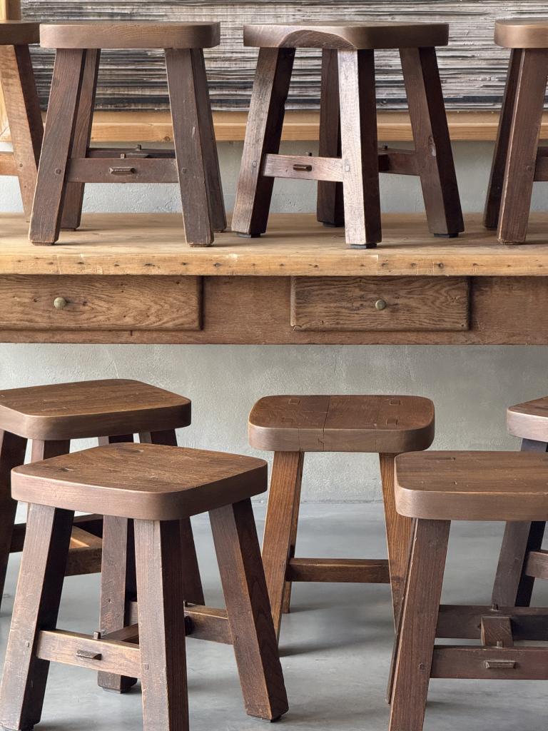 A set of 12 massive Elm Stools