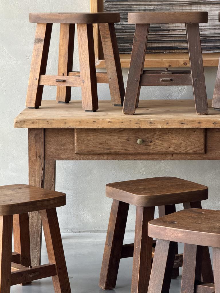 A set of 12 massive Elm Stools