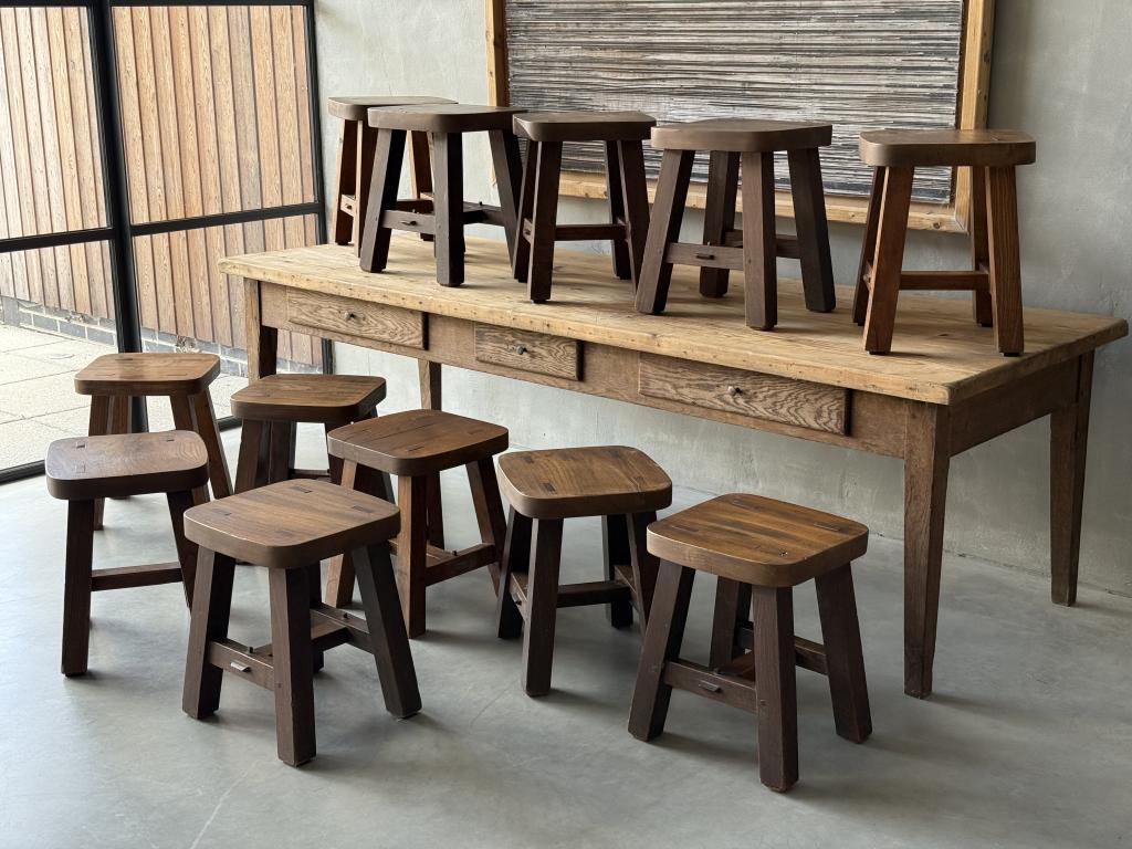 A set of 12 massive Elm Stools