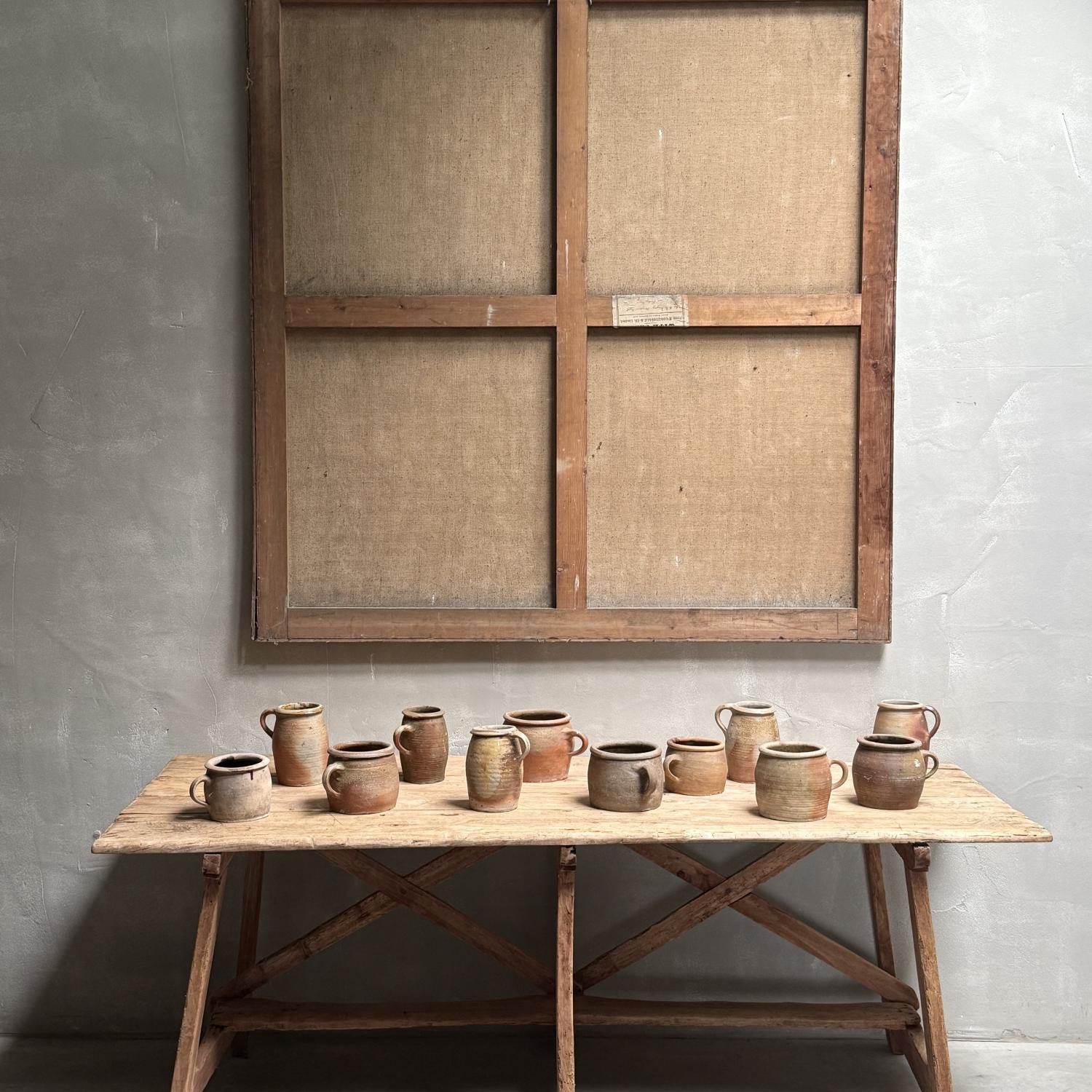 A Collection of 12 Stoneware Pots