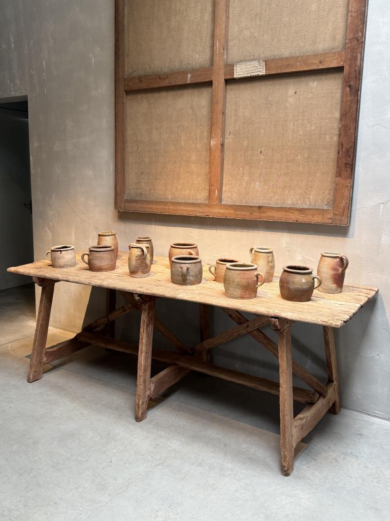 A Collection of 12 Stoneware Pots