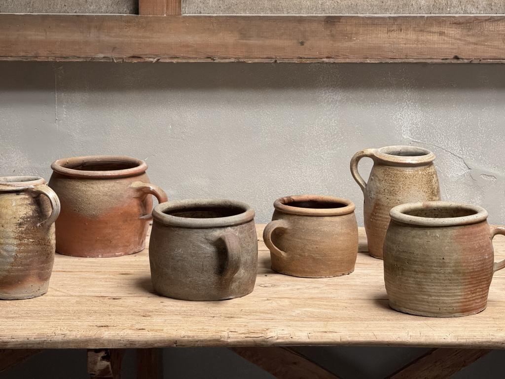 A Collection of 12 Stoneware Pots