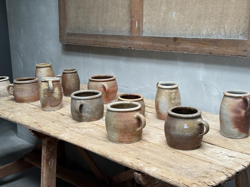 A Collection of 12 Stoneware Pots